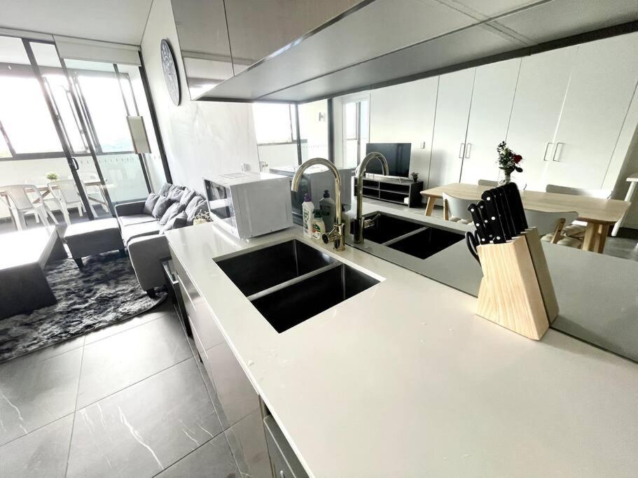 High Floor Skyline View 2br Close2olympic Park Apartment Sydney